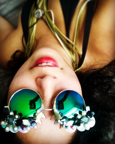 Picture - Model in Smiley Art Goods  Floral Sunglasses - Metallic Mirrored Sunglasses - Link to reorders