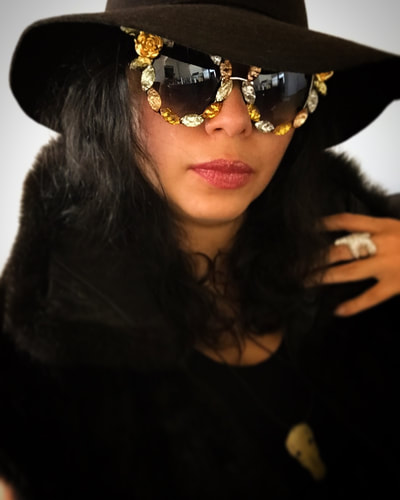 Picture - Model in luxury faux fur and Smiley Art Goods  Floral Sunglasses - Link to Shatter Flower Floral Gold Sunglasses
