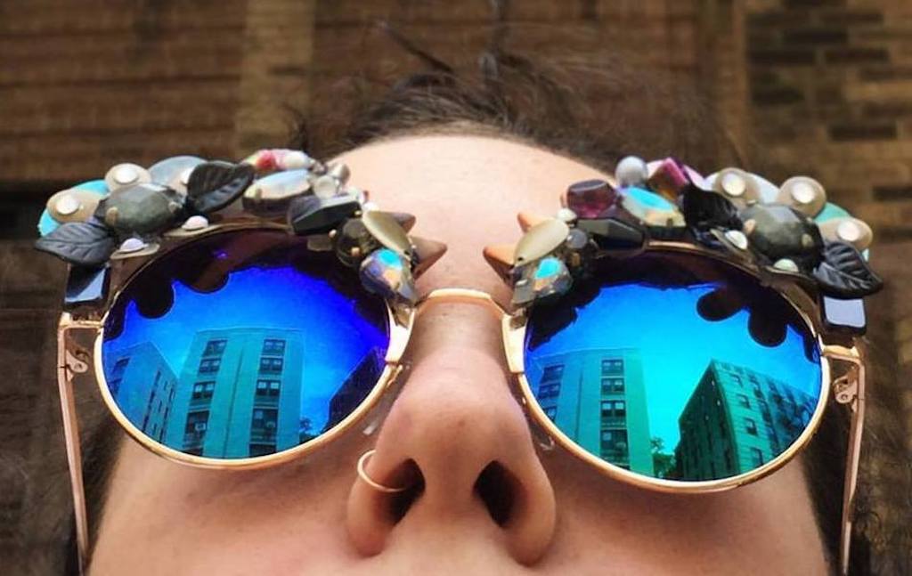 Picture - Model looks on NYC in Smiley Art Goods Eyewear - Link to Sunglasses Shop