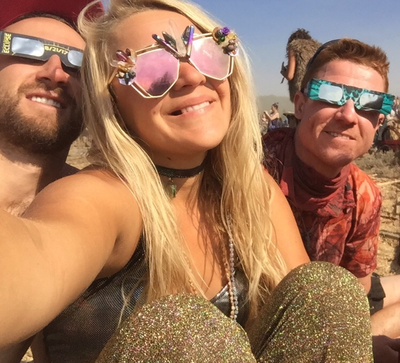Picture - Model at Global Eclipse Gathering festival in Smiley Art Goods  Third Eye Mirrored Sunglasses - Rose Gold Sunglasses - Link to reorders