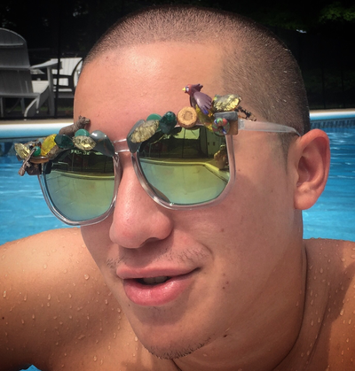 Picture - Model in pool in Smiley Art Goods  Green Mirrored Sunglasses - Gone Hunting Sunglasses - Link to reorders