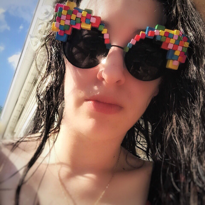 Picture - Model in Pixel Art Wooden Sunglasses from Smiley Art Goods - Link to Pixelate Me Round Sunglasses