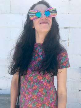 Picture - Kaleigh McKenna - Creator Founder of Smiley Art Goods in Baby Flowers Sunglasses